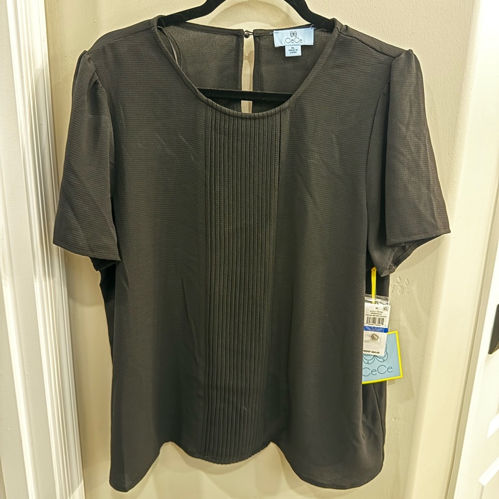 XL CeCe from Macy’s work top in Black. Tuxedo detail in front.